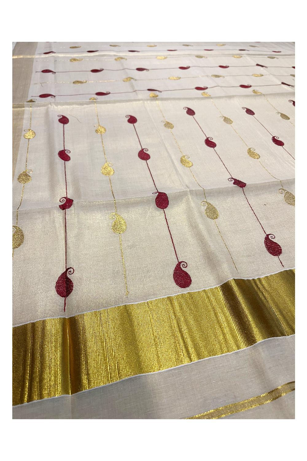 Kerala Tissue Kasavu Saree With Maroon and Golden Paisley Embroidery Works