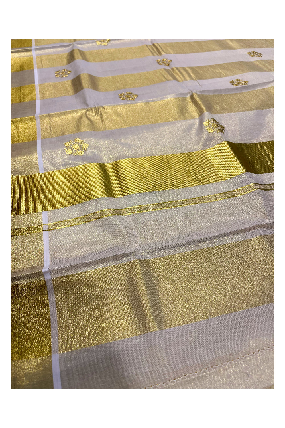 Kerala Tissue Kasavu Stripes Saree with Golden Floral Embroidery Designs on Body and Pallu