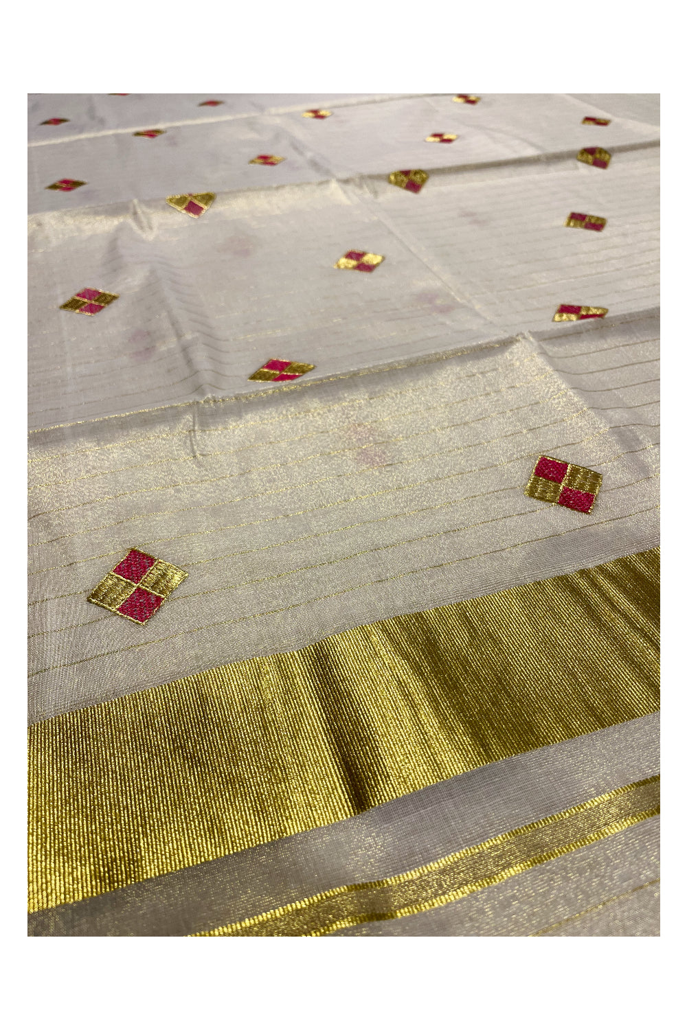 Kerala Tissue Kasavu Stripes Saree with Pink and Golden Diagonal Floral Embroidery Design on Body