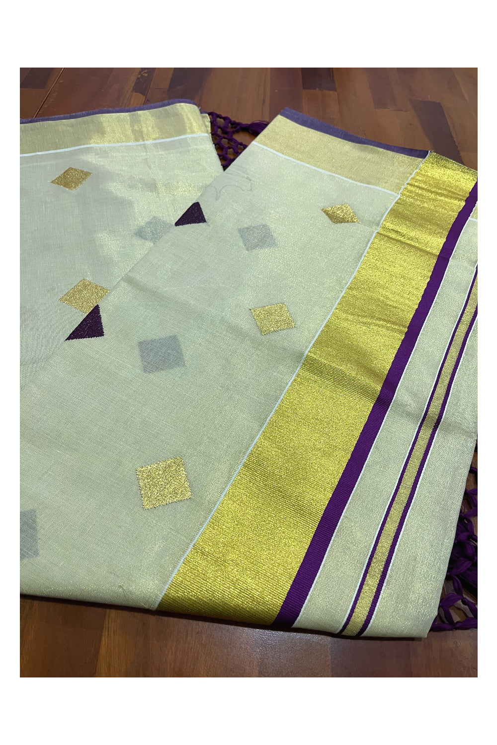 Kerala Tissue Kasavu Saree with Purple Woven Butta Designs and Tassels Works