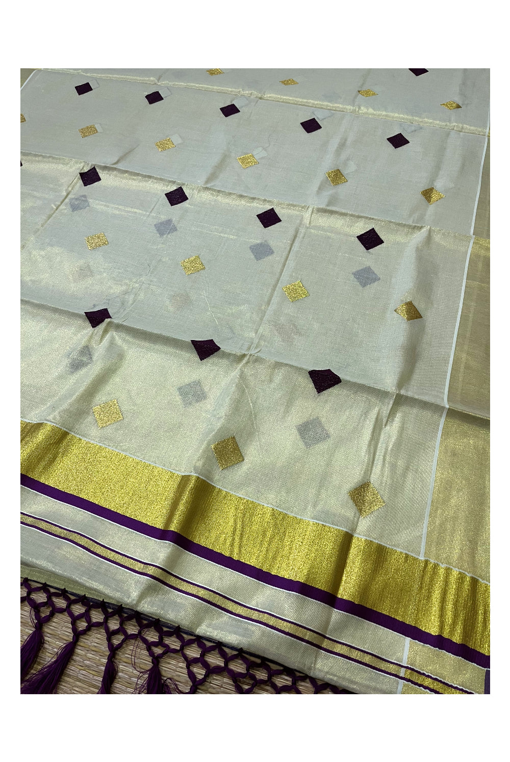 Kerala Tissue Kasavu Saree with Purple Woven Butta Designs and Tassels Works