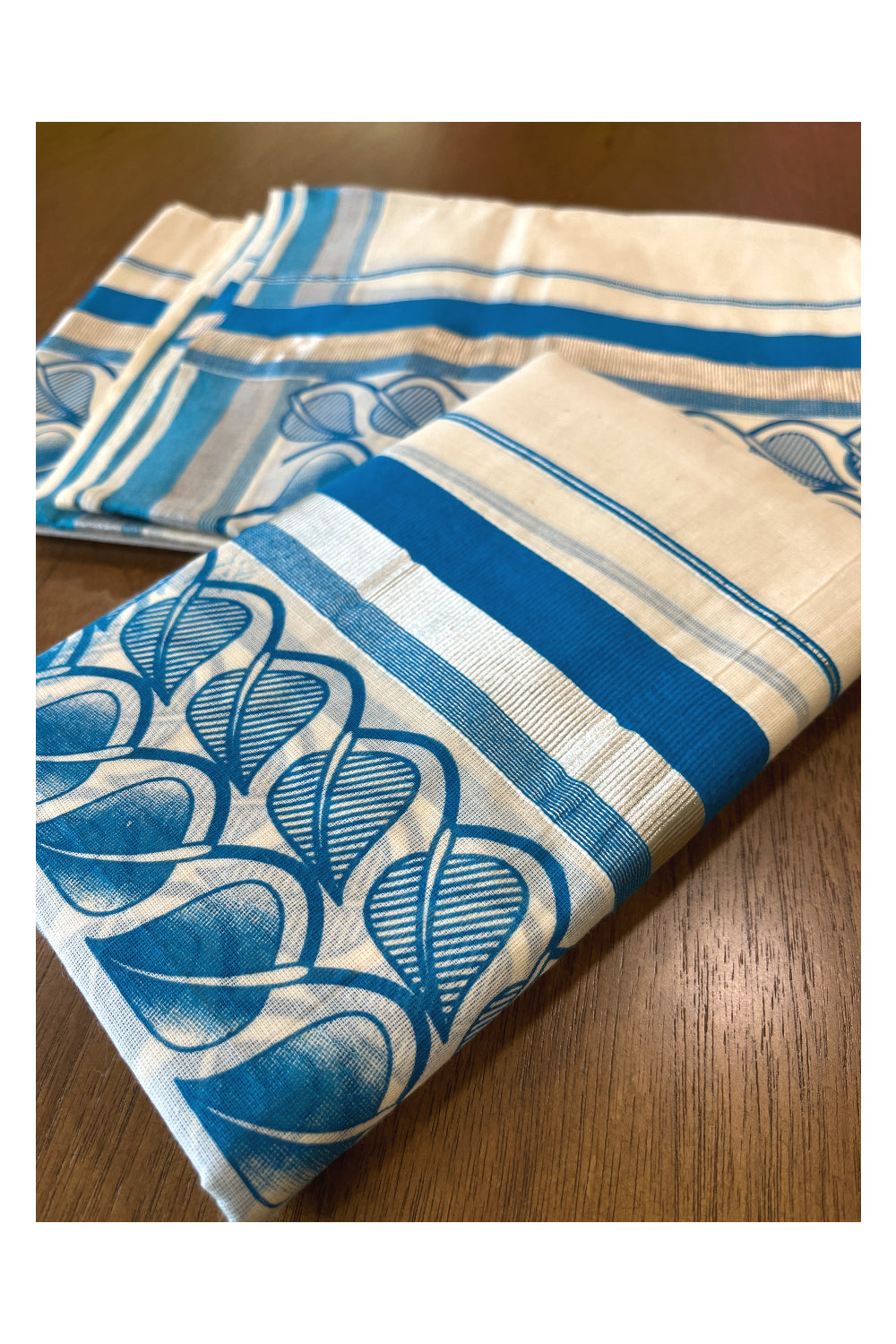 Cotton Single Set Mundu (Mundu Neriyathum) with Block Prints on Silver Kasavu and Blue Border