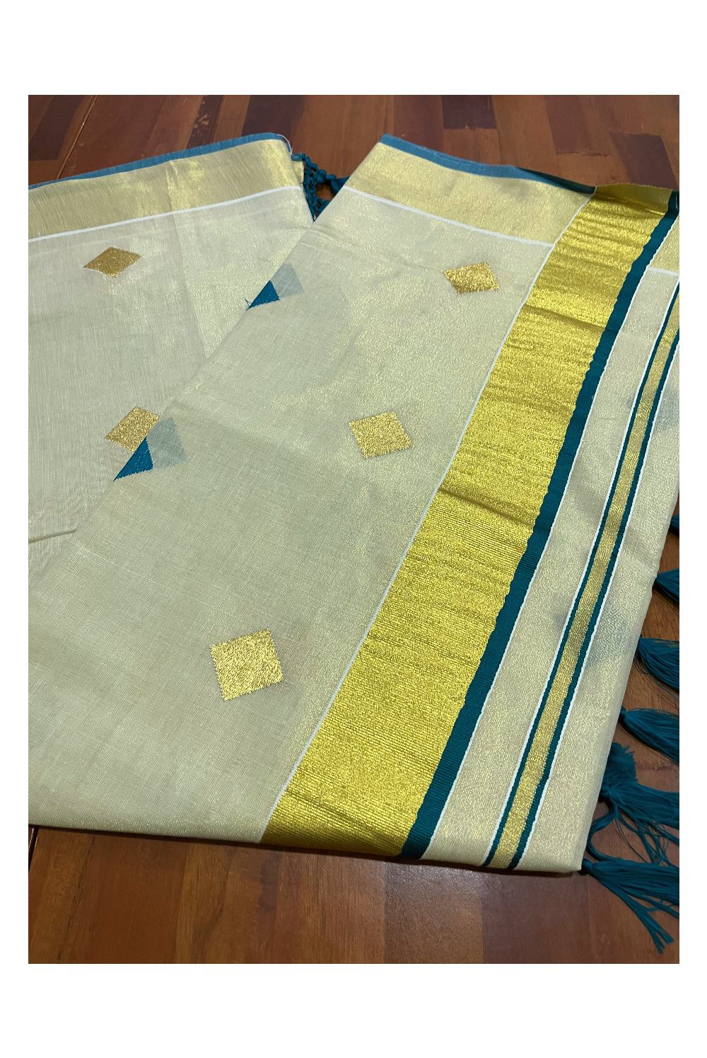 Kerala Tissue Kasavu Saree with Green Woven Butta Designs and Tassels Works