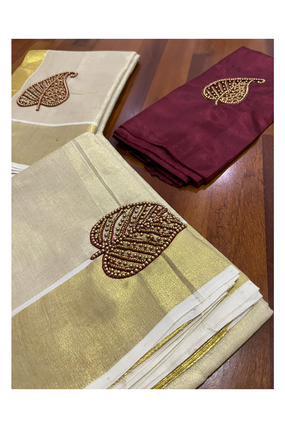 Kerala Tissue Kasavu Set Mundu (Mundum Neriyathum) with Leaf Bead Handwork Design and Maroon Blouse Piece
