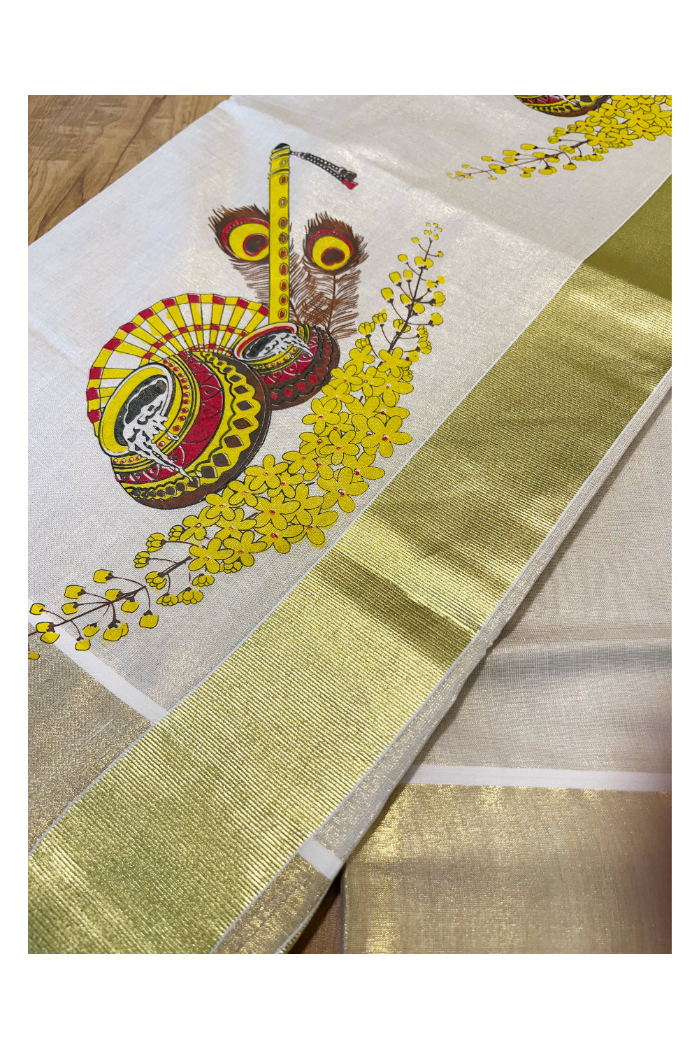 Kerala Tissue Kasavu Saree with Peacock Feather and Flute Mural Printed Designs