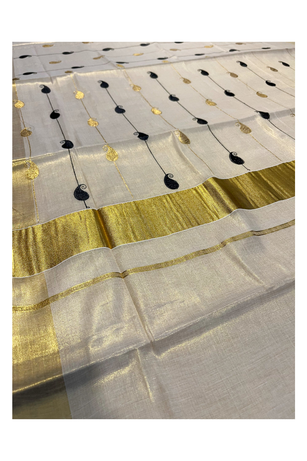 Kerala Tissue Kasavu Saree With Black and Golden Paisley Embroidery Works