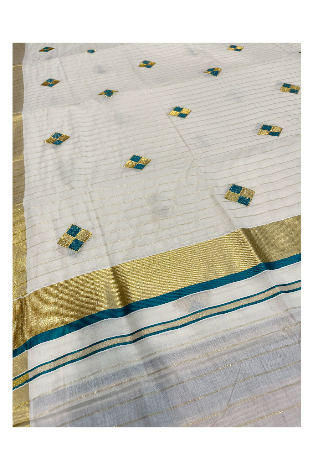 Kerala Cotton Kasavu Lines Saree with Peacock Green and Golden Diagonal Embroidery Work