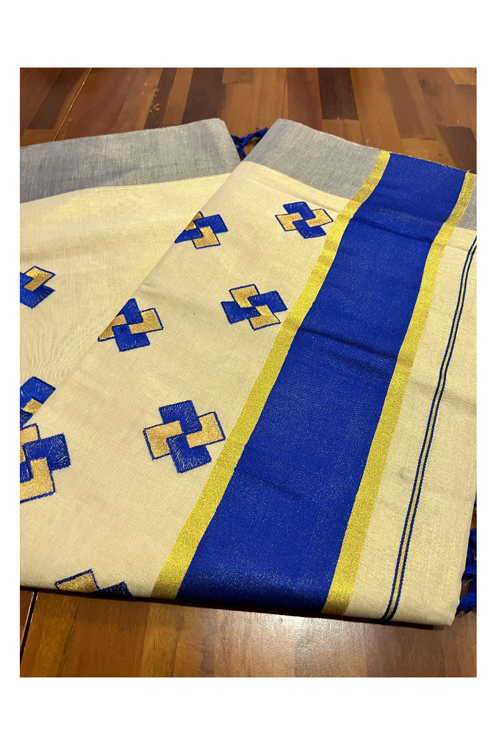 Kerala Tissue Kasavu Saree With Blue Border and Embroidered Designs on Body