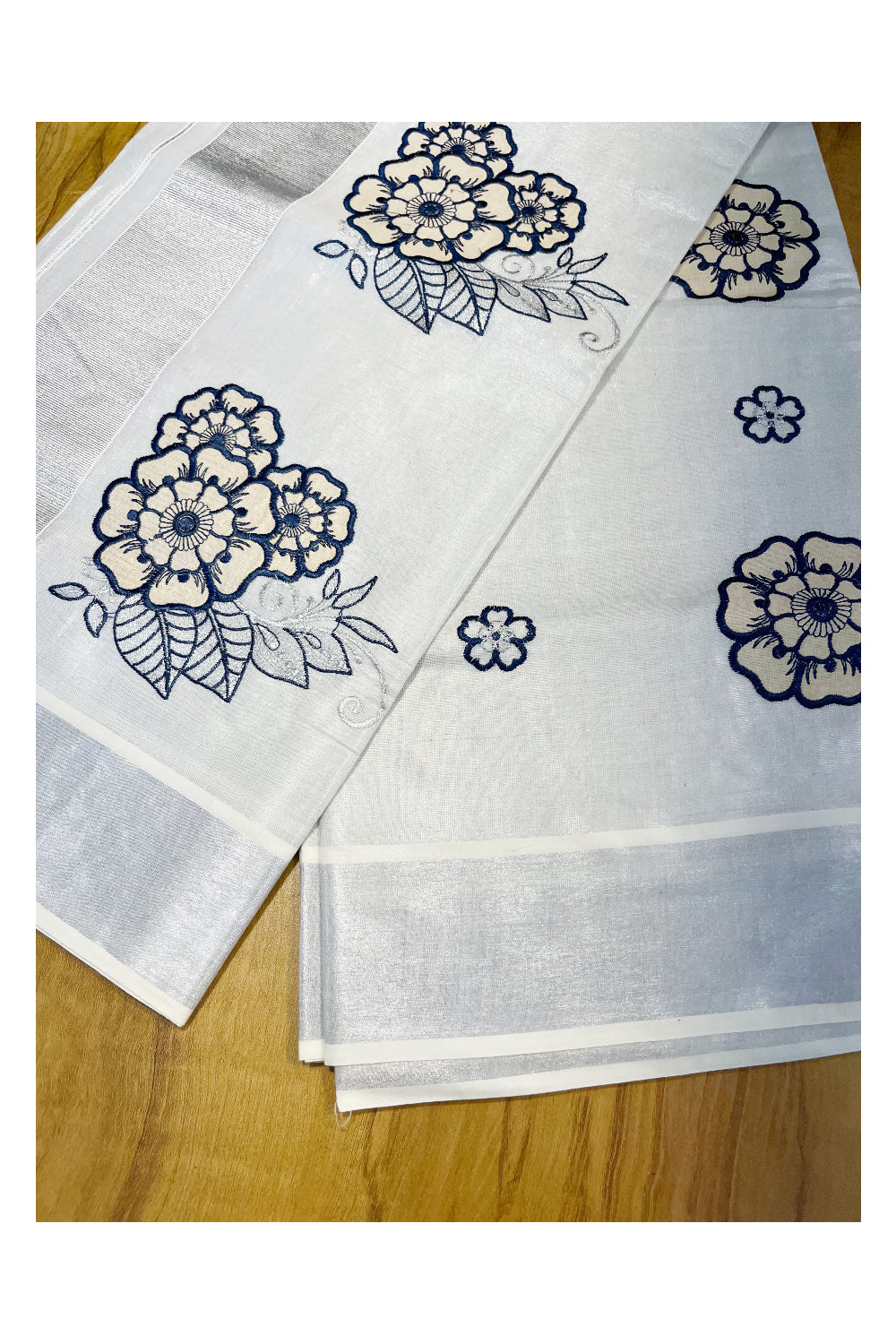 Southloom Kerala Siver Tissue Saree with Blue Flower Embroidery Work