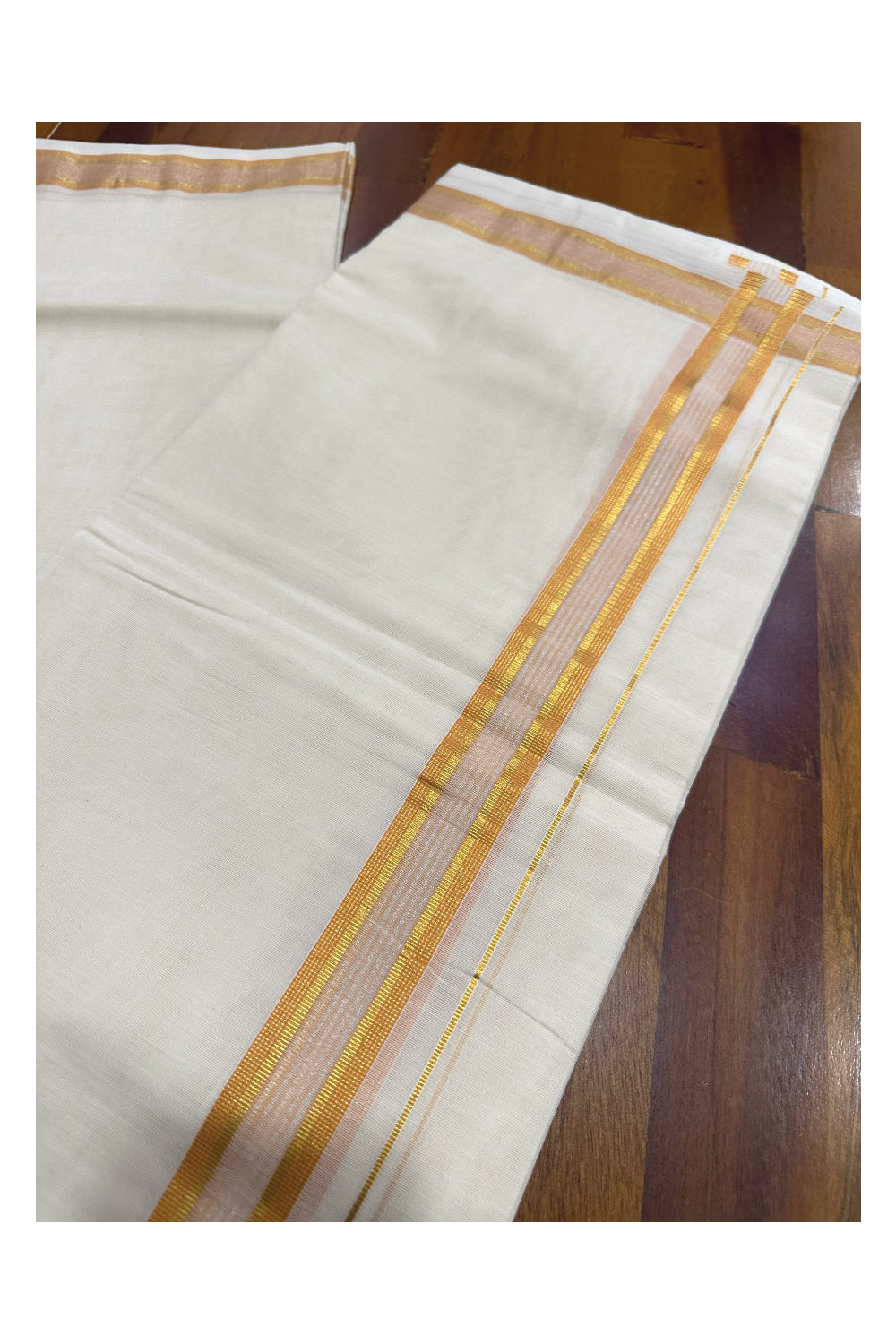 Southloom Premium Handloom Mundu with Orange and Kasavu Kara (Onam Mundu 2023)