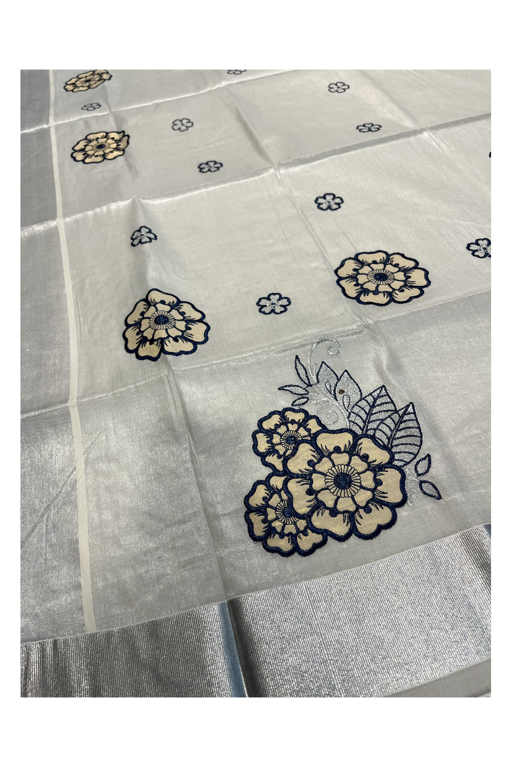 Southloom Kerala Siver Tissue Saree with Blue Flower Embroidery Work