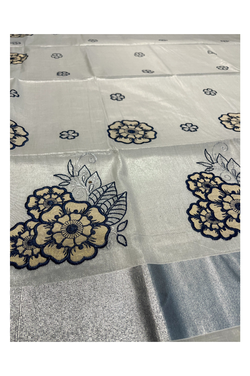 Southloom Kerala Siver Tissue Saree with Blue Flower Embroidery Work