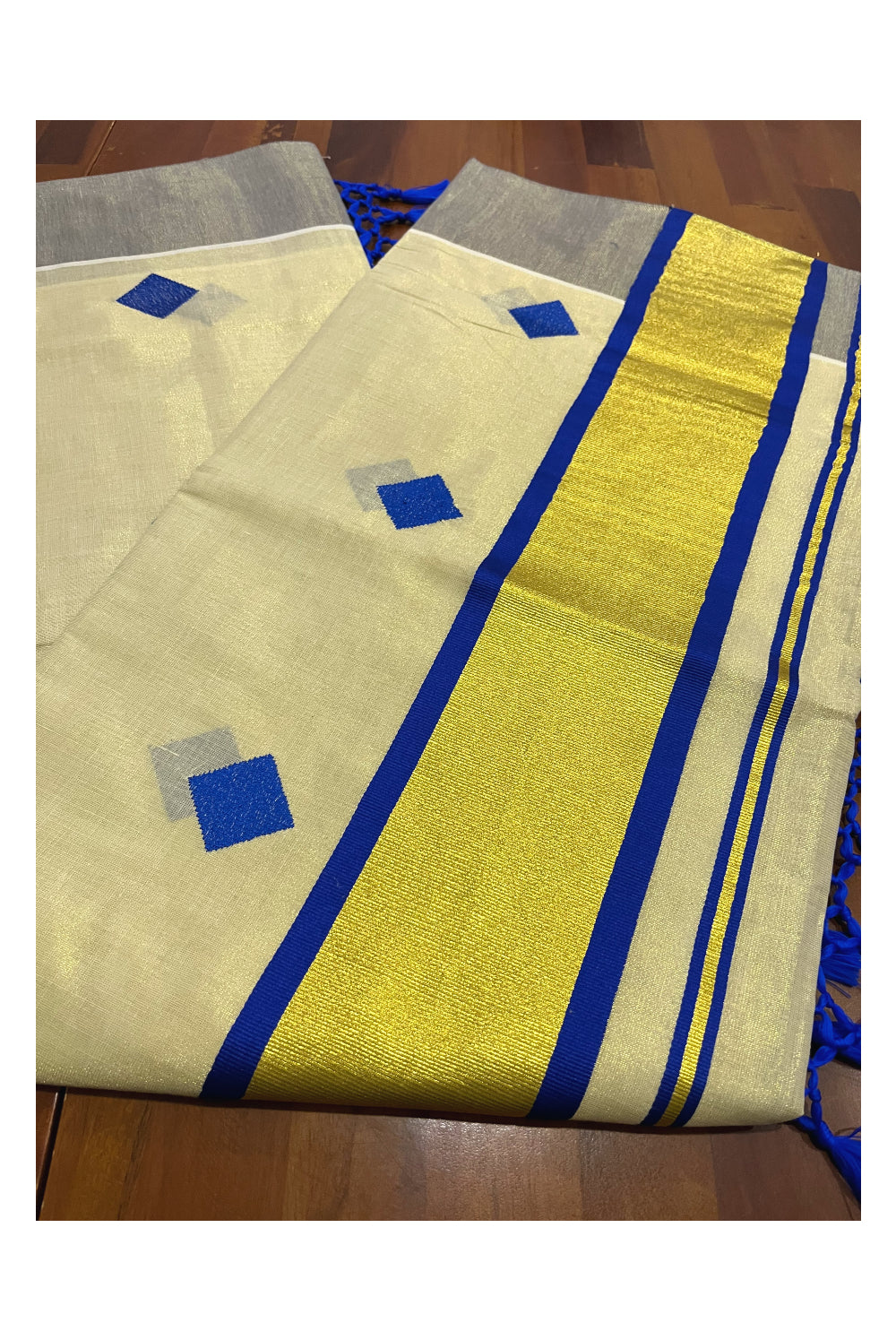 Kerala Tissue Kasavu Saree with Blue Woven Butta Designs and Tassels Works