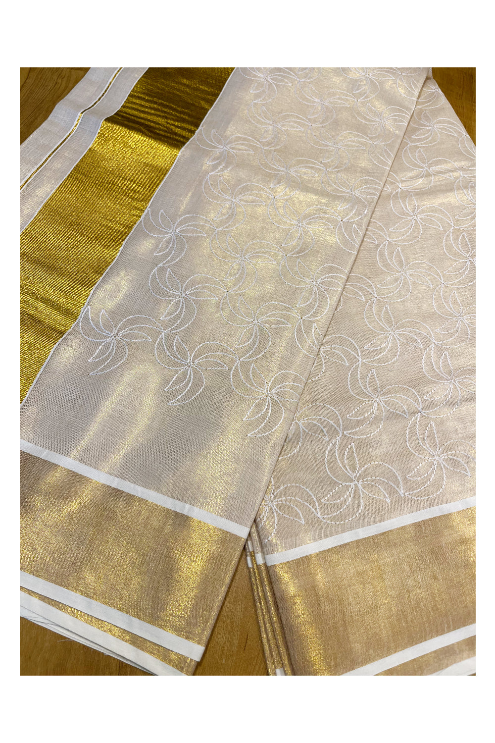 Kerala Tissue Kasavu Saree With White Floral Embroidery Works