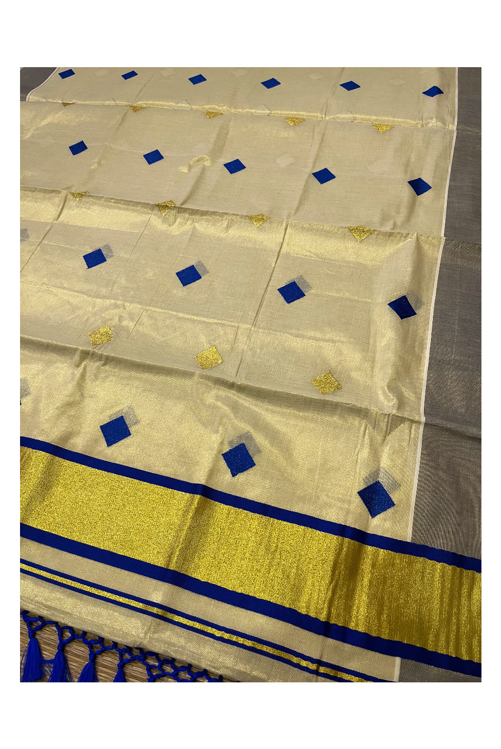 Kerala Tissue Kasavu Saree with Blue Woven Butta Designs and Tassels Works