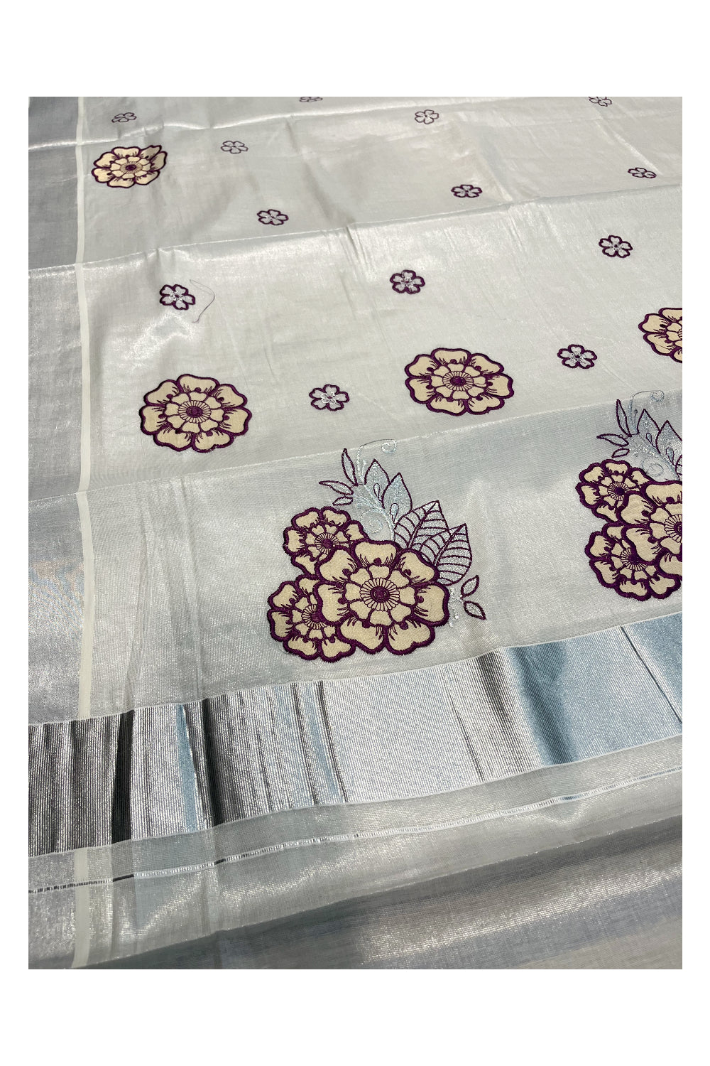 Southloom Kerala Siver Tissue Saree with Violet Flower Embroidery Work