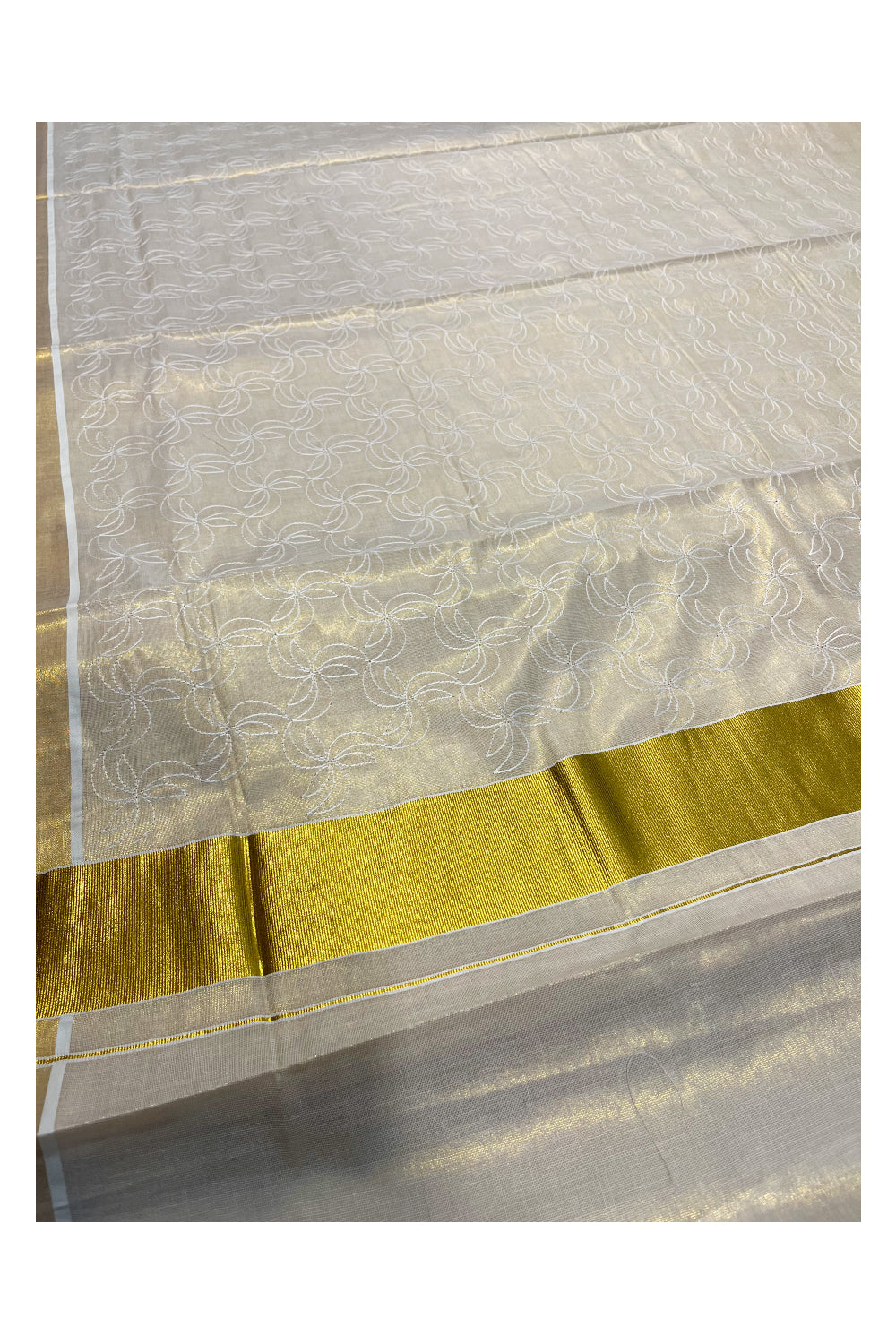 Kerala Tissue Kasavu Saree With White Floral Embroidery Works