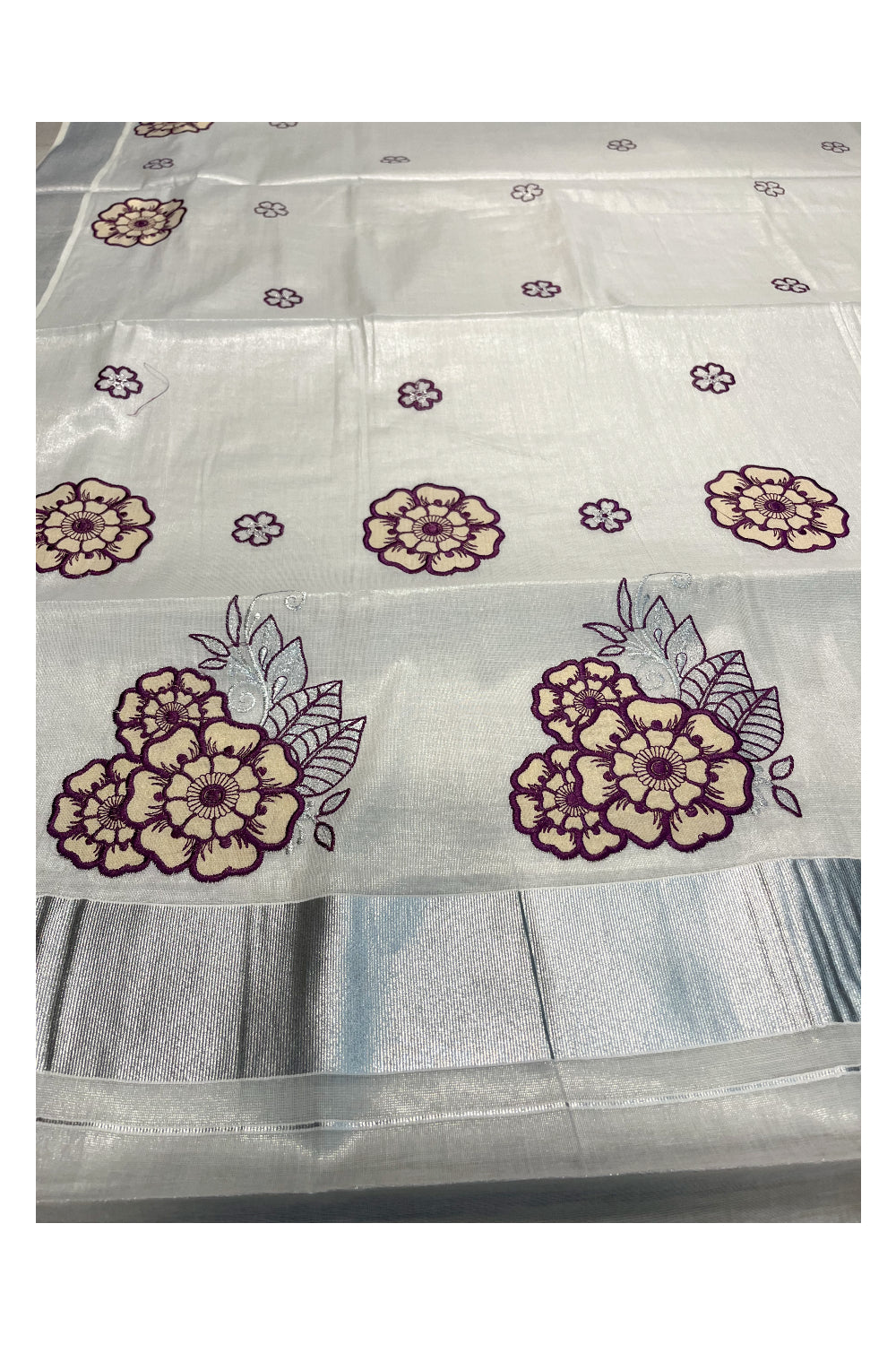 Southloom Kerala Siver Tissue Saree with Violet Flower Embroidery Work