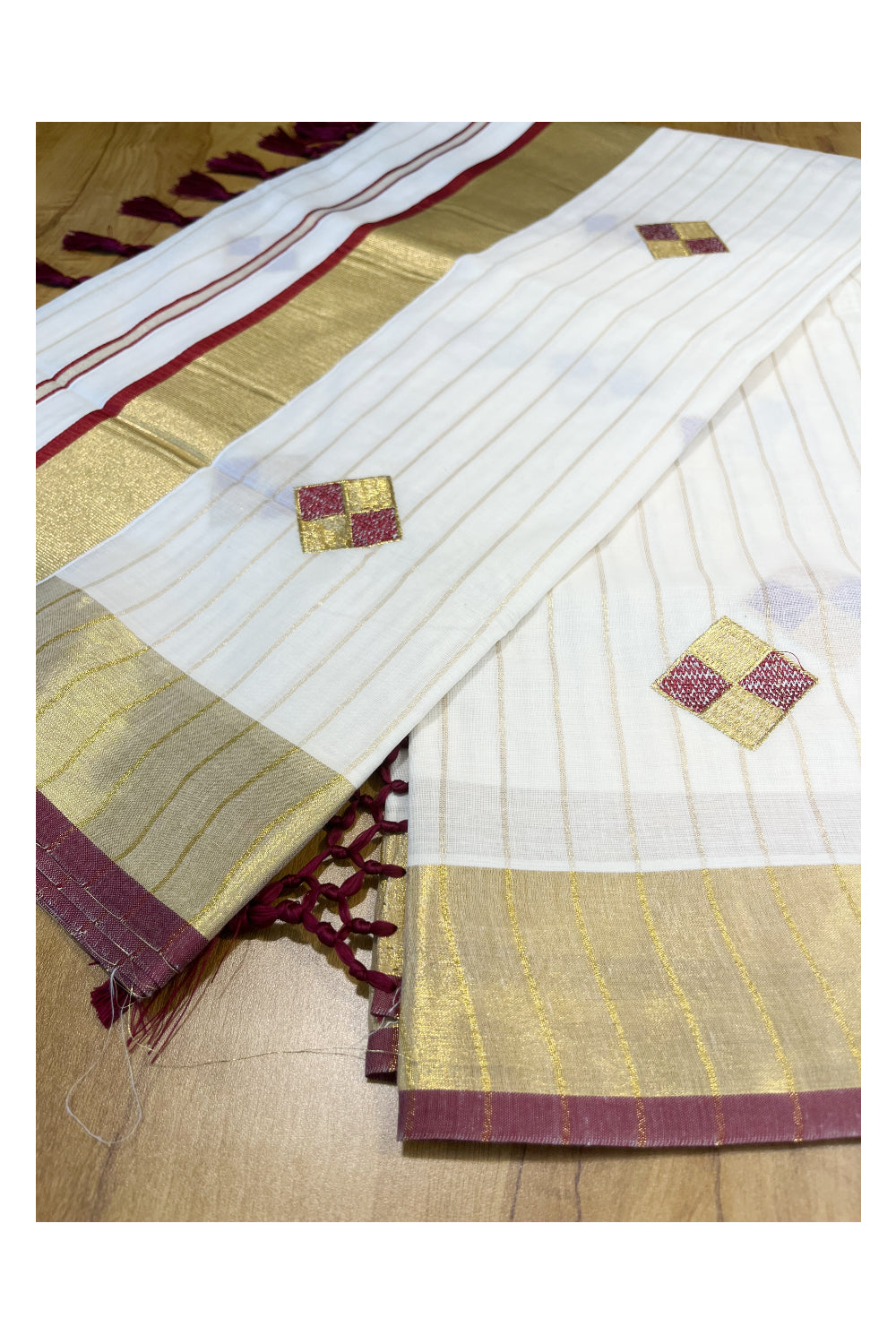 Kerala Cotton Kasavu Lines Saree with Maroon and Golden Diagonal Embroidery Work