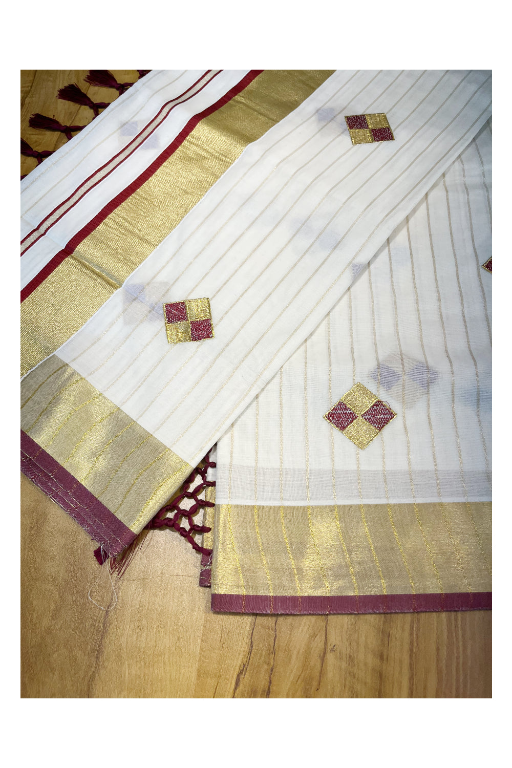 Kerala Cotton Kasavu Lines Saree with Maroon and Golden Diagonal Embroidery Work