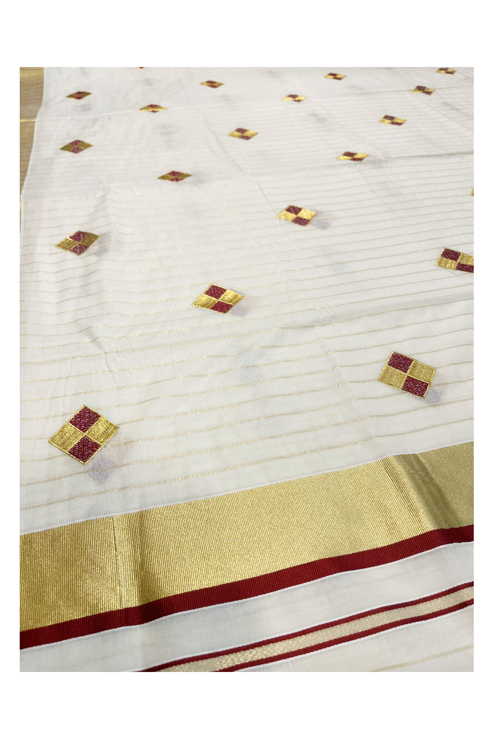 Kerala Cotton Kasavu Lines Saree with Maroon and Golden Diagonal Embroidery Work