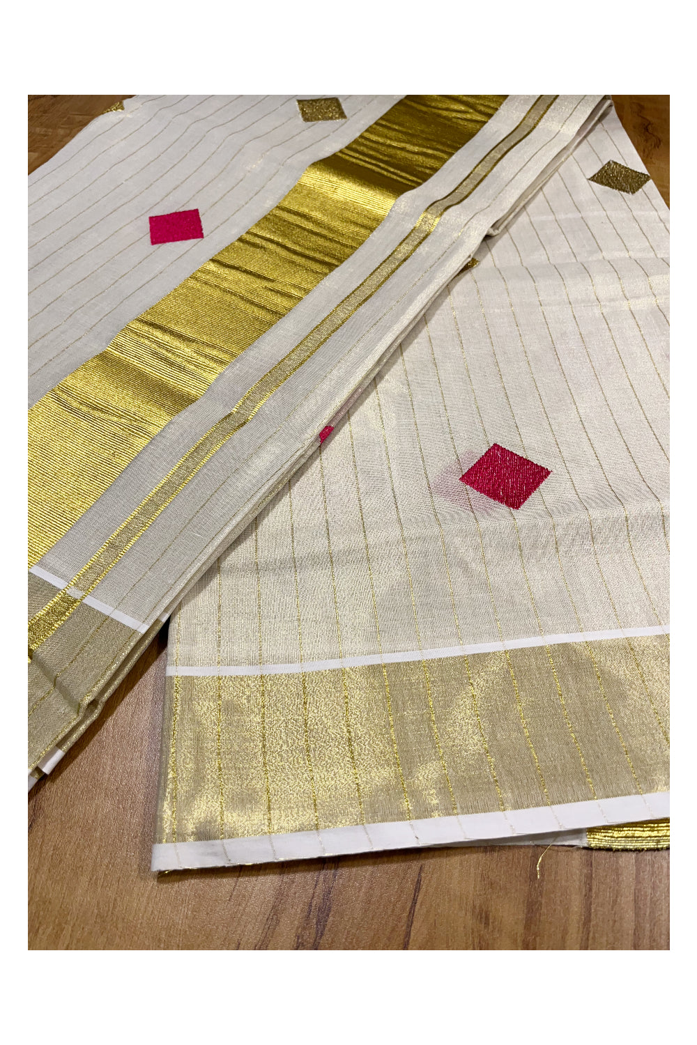 Kerala Tissue Kasavu Lines Saree with Pink and Golden Diagonal Woven Designs on Body and Pallu