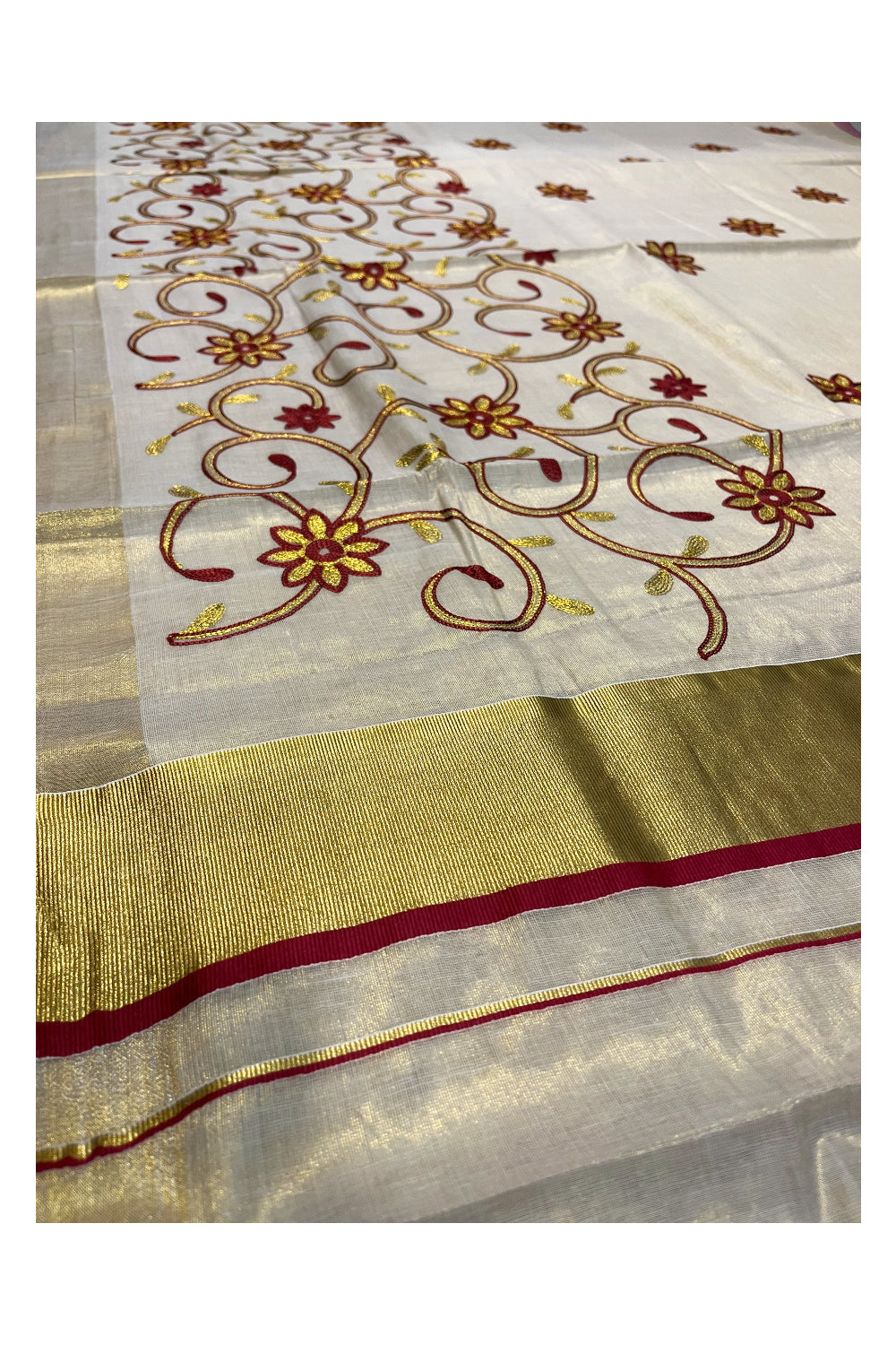 Kerala Tissue Kasavu Saree With Maroon and Golden Floral Embroidery Works