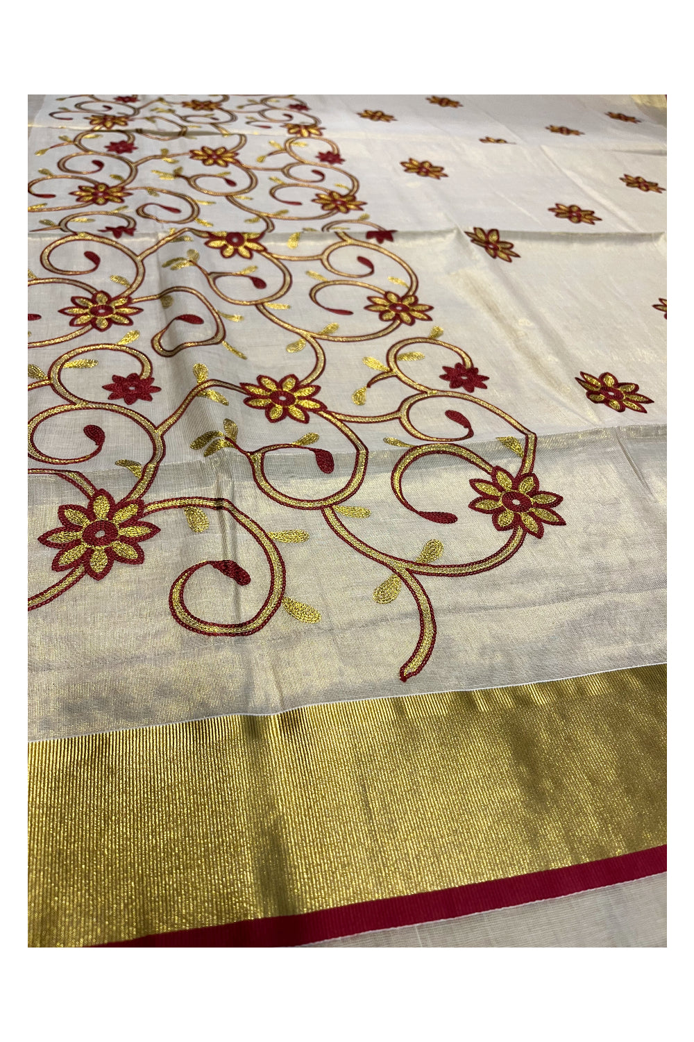 Kerala Tissue Kasavu Saree With Maroon and Golden Floral Embroidery Works