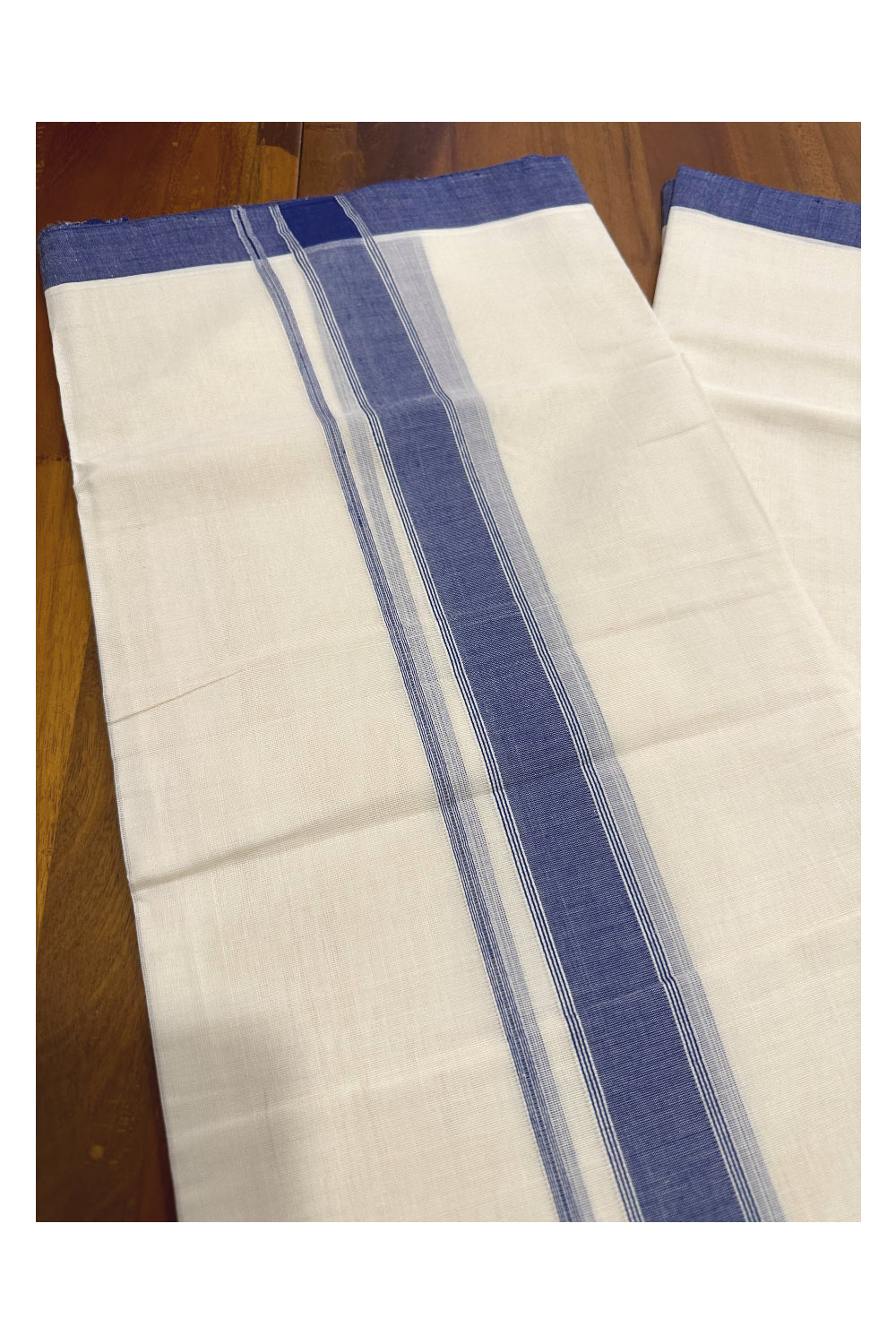 Southloom Premium Handloom Mundu with Blue Kara (Onam Mundu 2023)