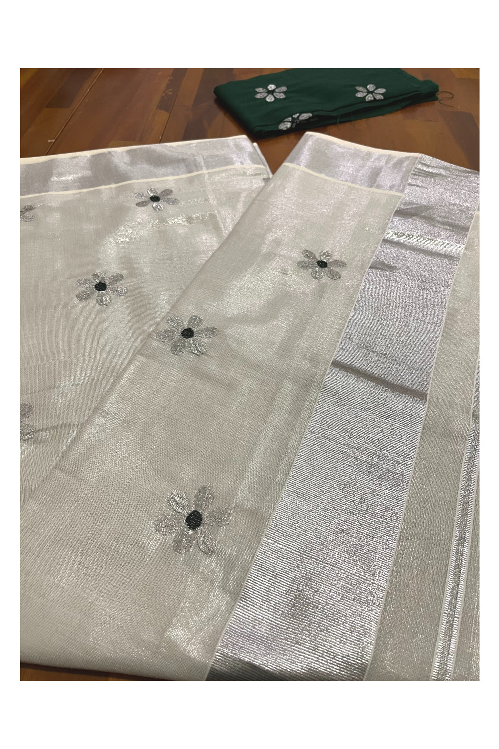 Kerala Silver Tissue Kasavu Saree with Floral Embroidery Works on Body and Dark Green Blouse Piece