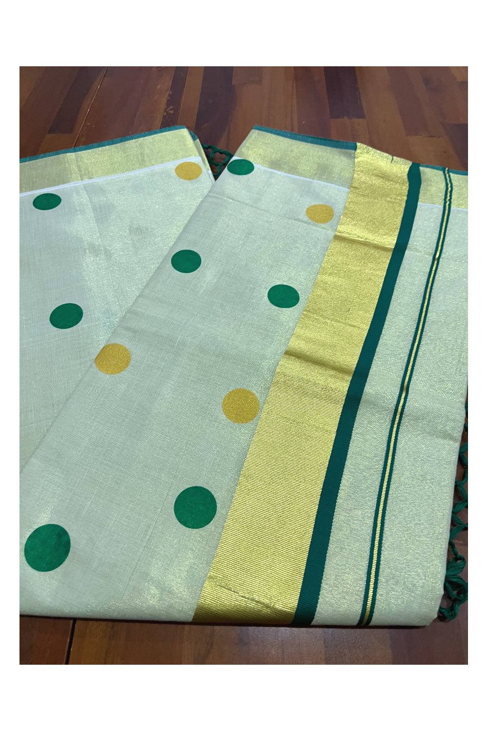 Kerala Tissue Kasavu Saree with Light Green and Golden Polka Prints and Tassels Works