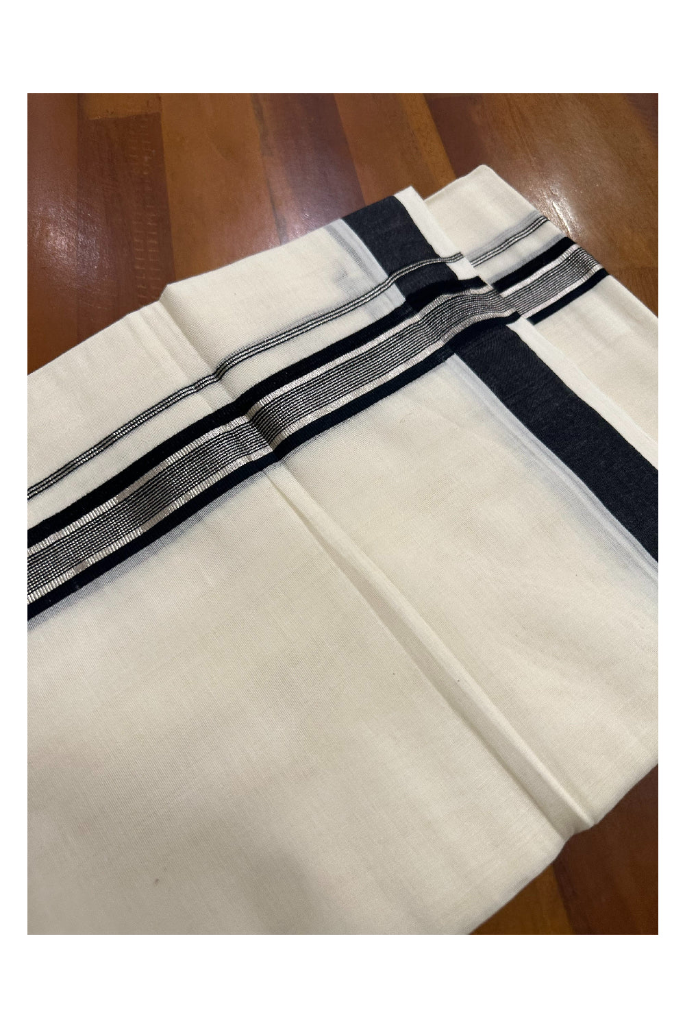 Southloom Premium Handloom Mundu with Black and Silver Kasavu Kara (Onam Mundu 2023)