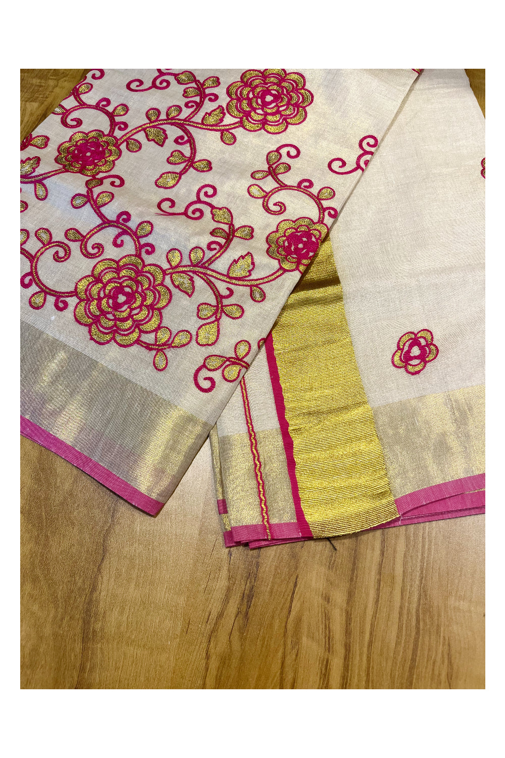 Kerala Tissue Kasavu Saree With Pink and Golden Floral Embroidery Works