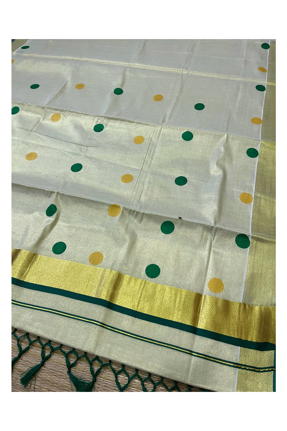 Kerala Tissue Kasavu Saree with Light Green and Golden Polka Prints and Tassels Works