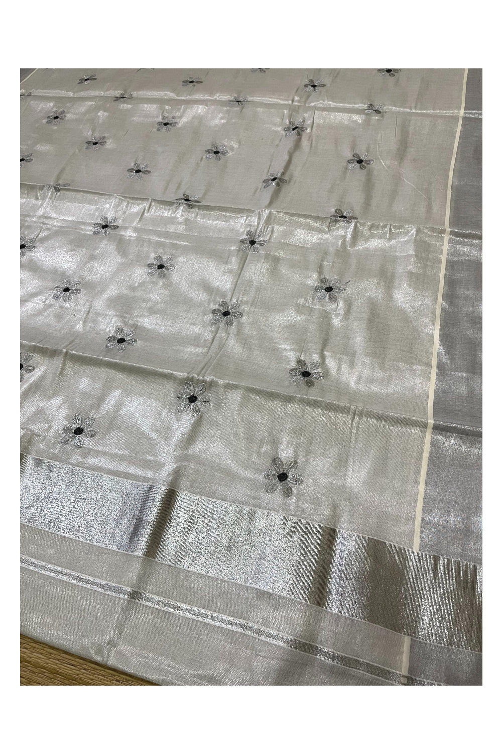 Kerala Silver Tissue Kasavu Saree with Floral Embroidery Works on Body and Dark Green Blouse Piece