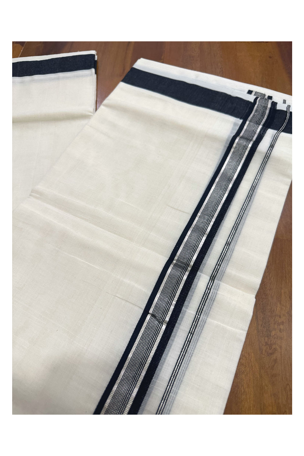 Southloom Premium Handloom Mundu with Black and Silver Kasavu Kara (Onam Mundu 2023)