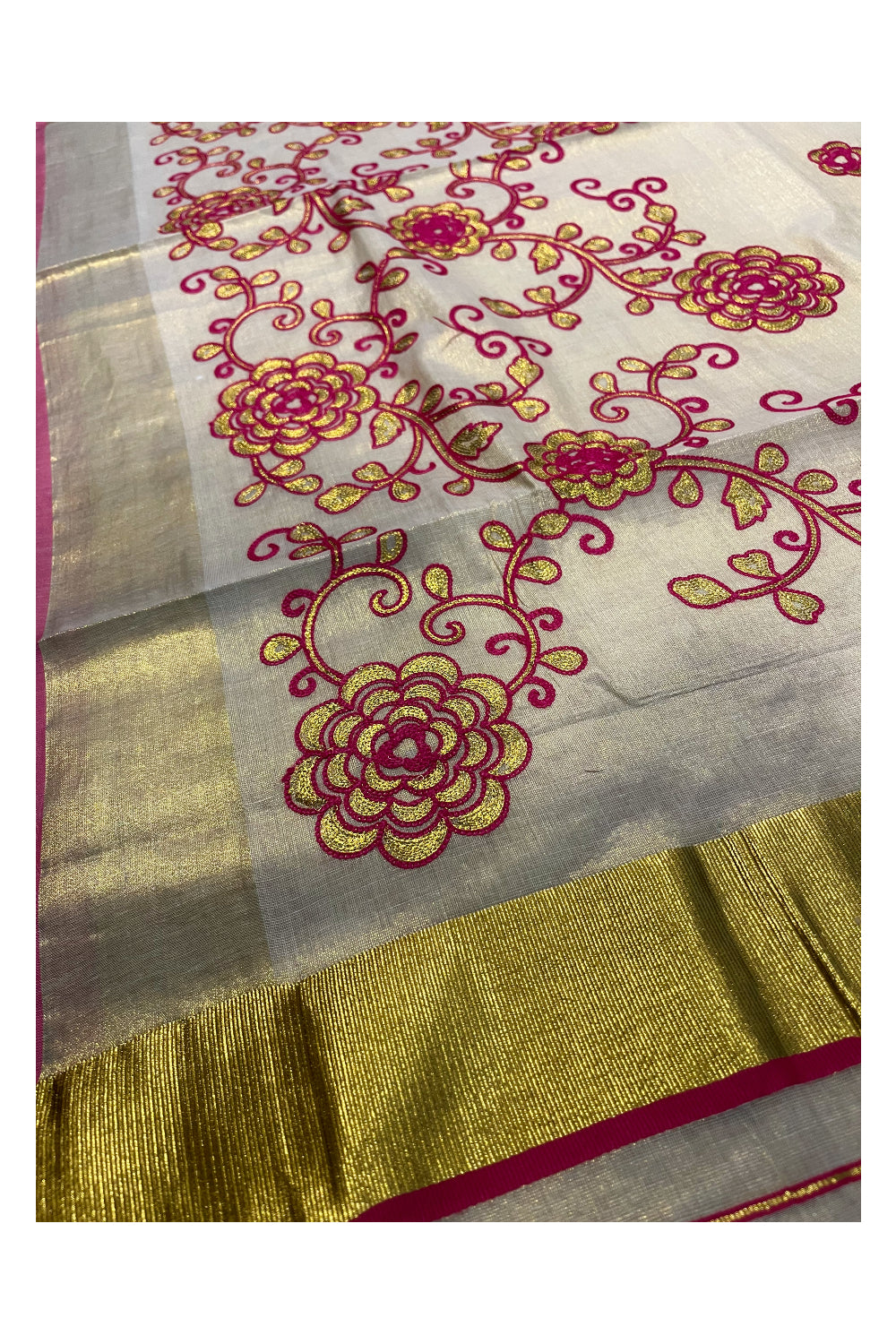 Kerala Tissue Kasavu Saree With Pink and Golden Floral Embroidery Works