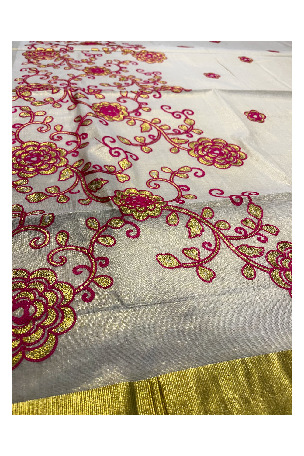 Kerala Tissue Kasavu Saree With Pink and Golden Floral Embroidery Works