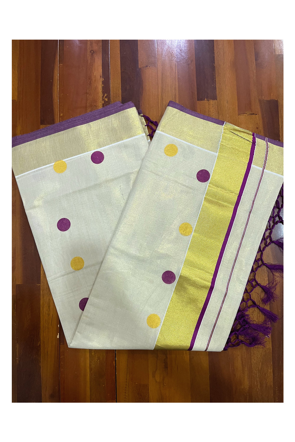 Kerala Tissue Kasavu Saree with Purple and Golden Polka Prints and Tassels Works