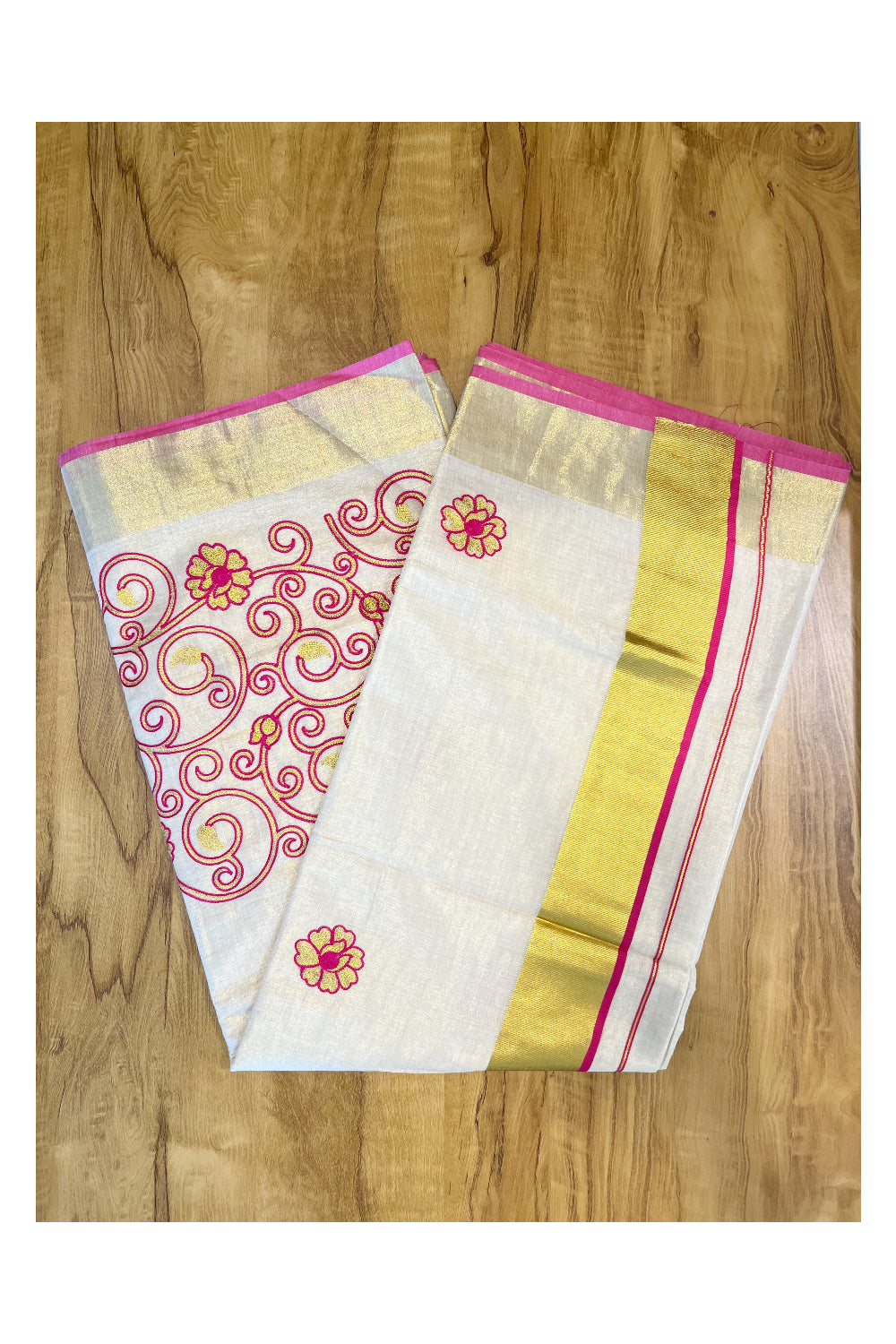 Kerala Tissue Kasavu Saree With Pink and Golden Floral Embroidery Works