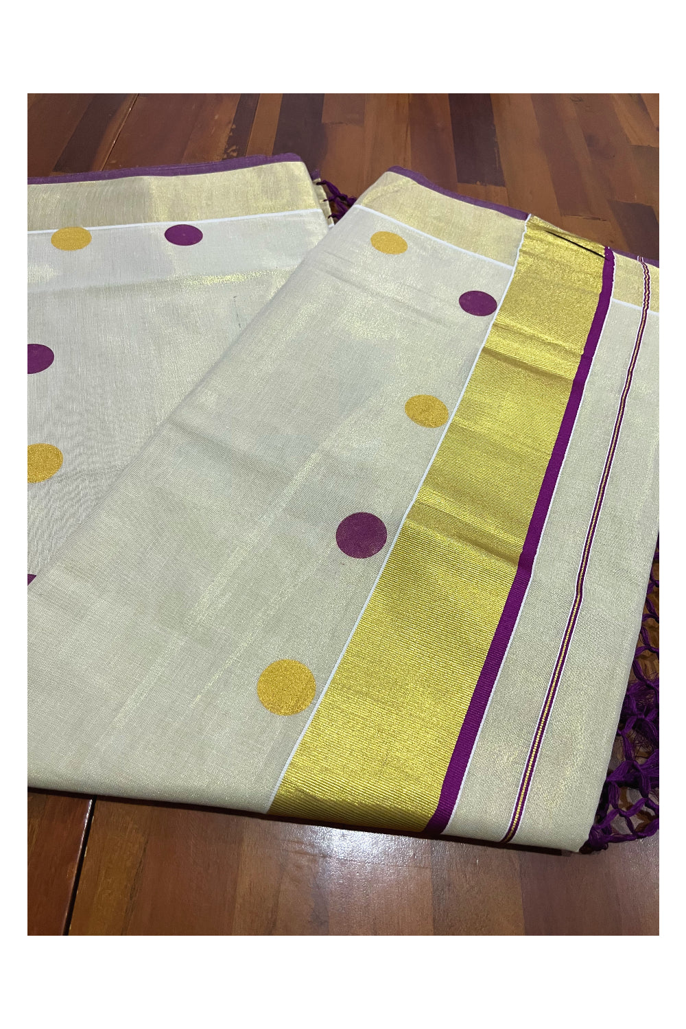 Kerala Tissue Kasavu Saree with Purple and Golden Polka Prints and Tassels Works