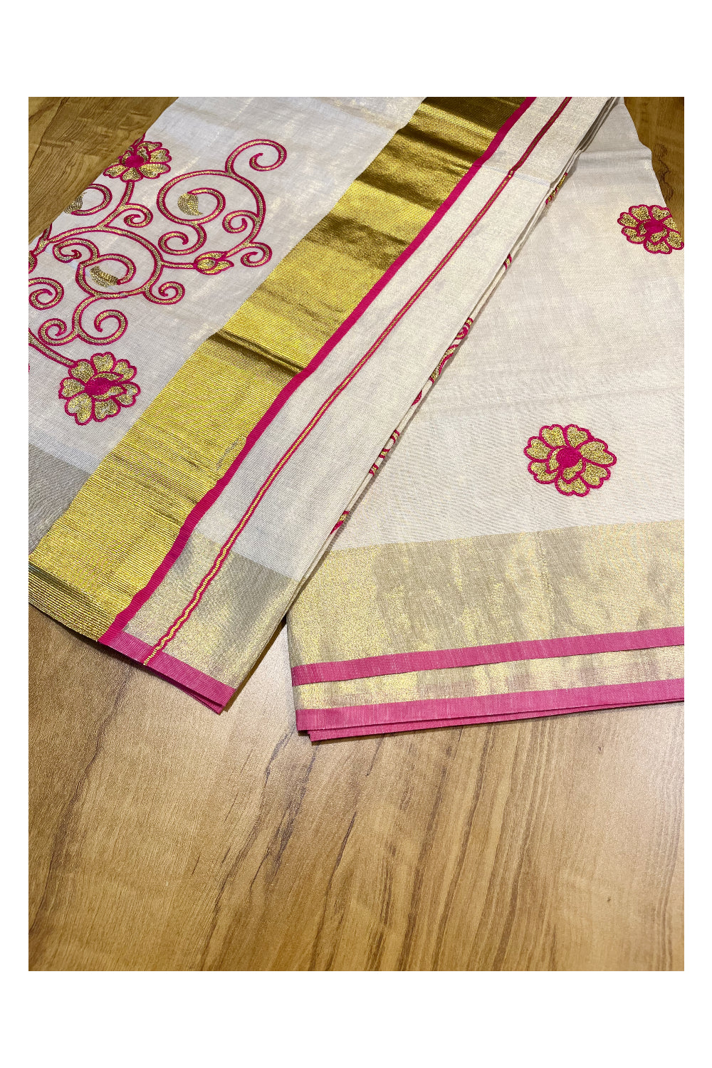 Kerala Tissue Kasavu Saree With Pink and Golden Floral Embroidery Works