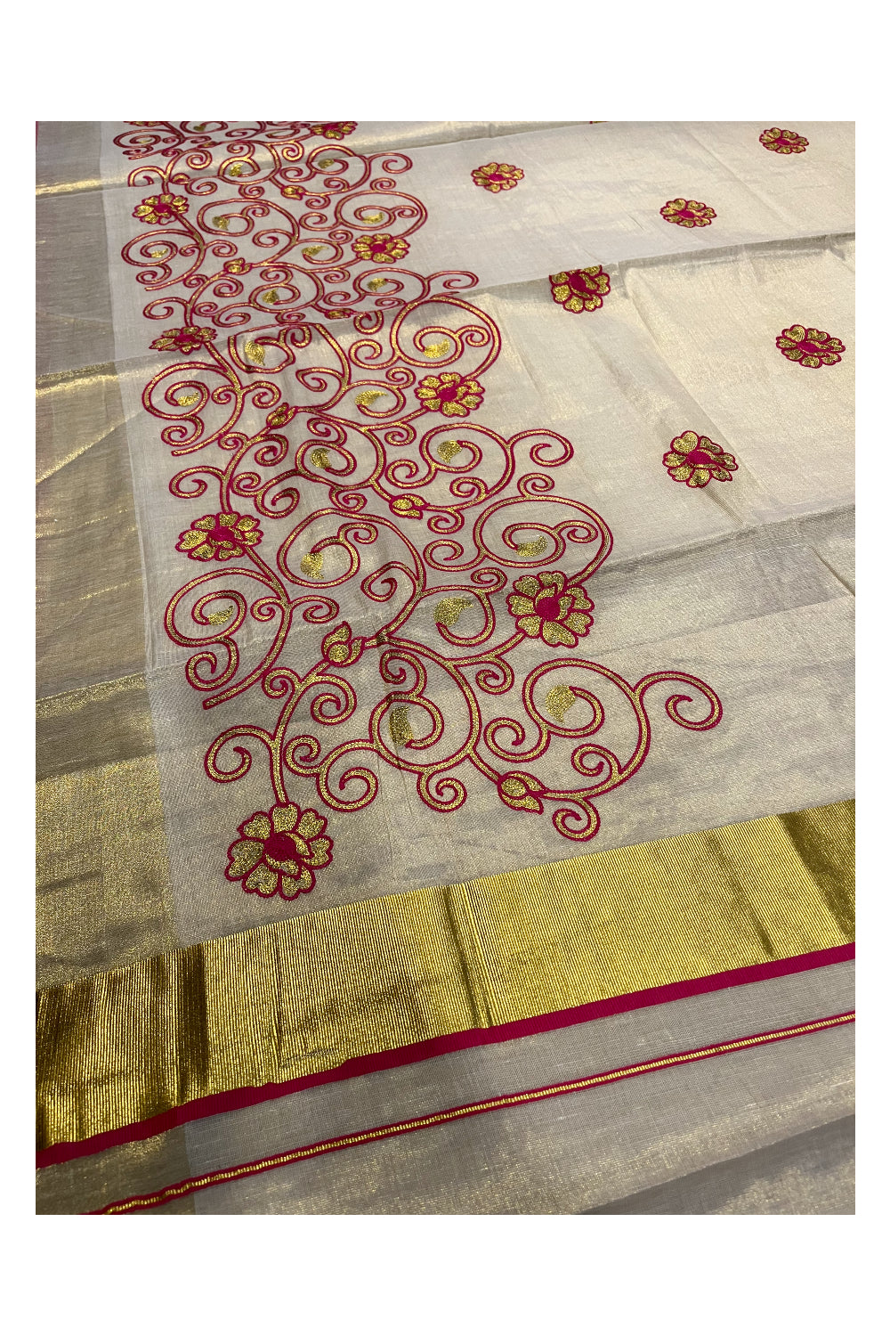 Kerala Tissue Kasavu Saree With Pink and Golden Floral Embroidery Works