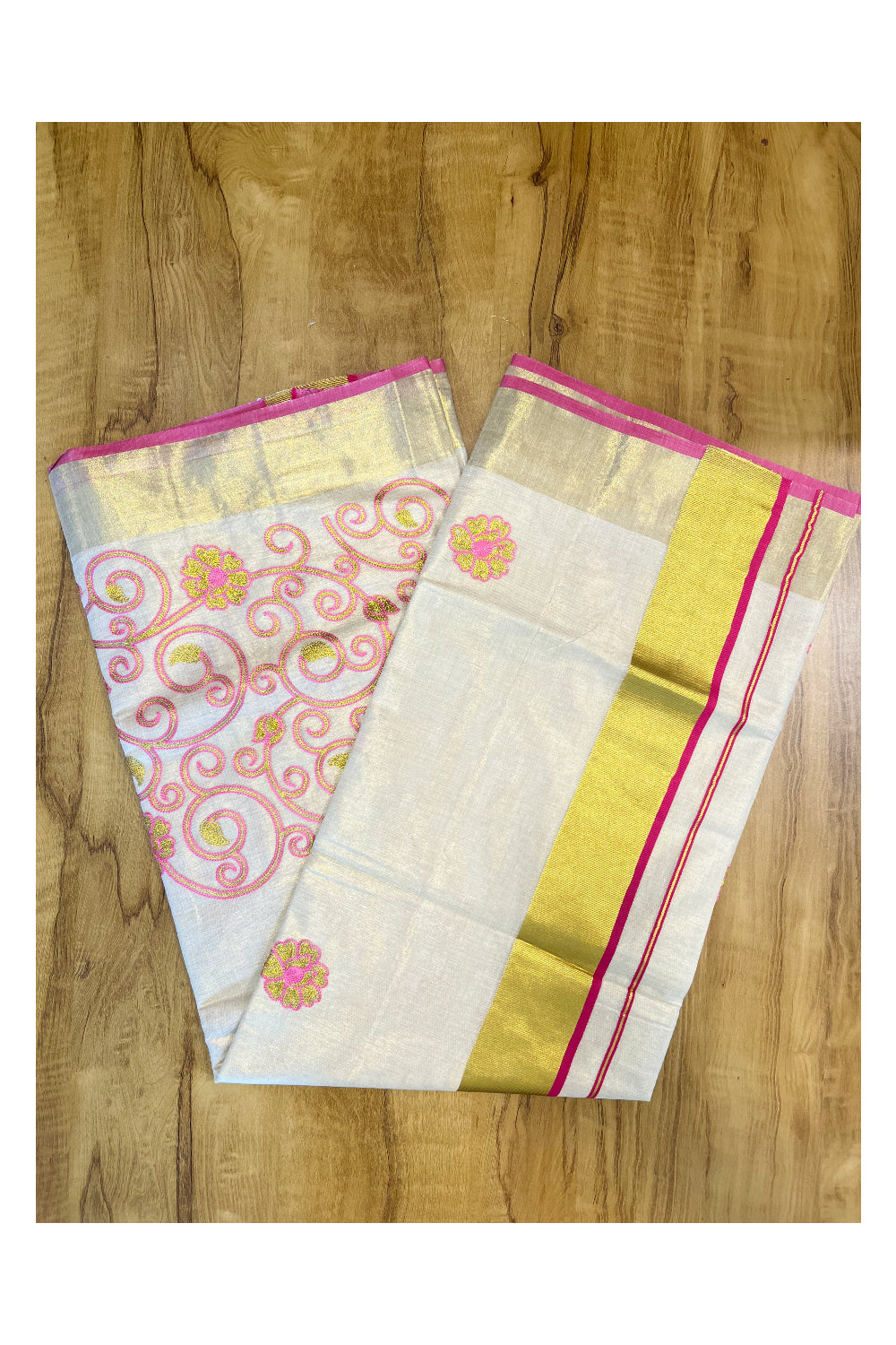 Kerala Tissue Kasavu Saree With Pink and Golden Floral Embroidery Works