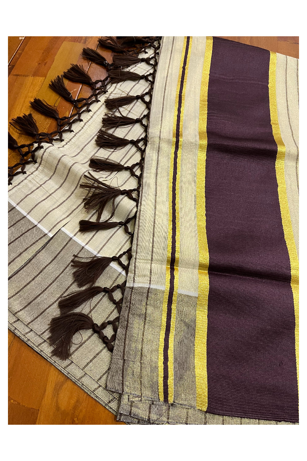 Kerala Tissue Purple Striped Saree with Kasavu Border and Tassels Works