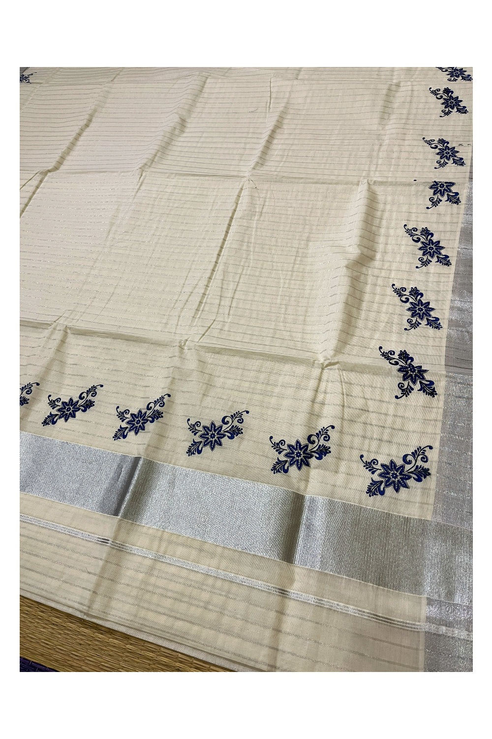 Pure Cotton Kerala Saree with Silver Lines and Blue Floral Block Prints on Border