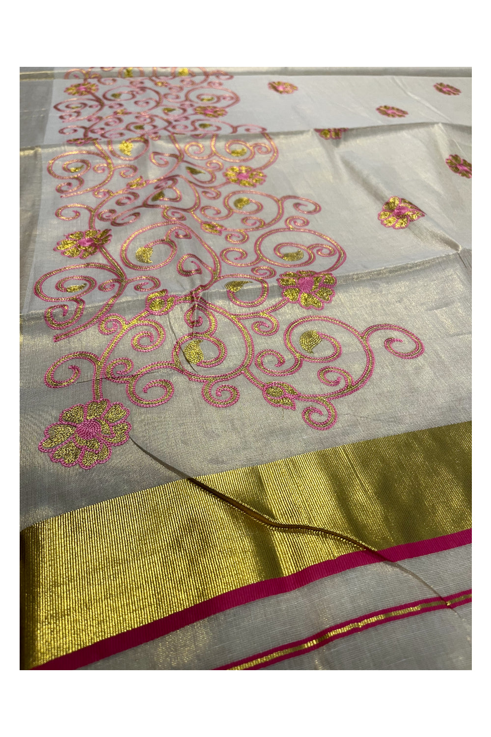 Kerala Tissue Kasavu Saree With Pink and Golden Floral Embroidery Works