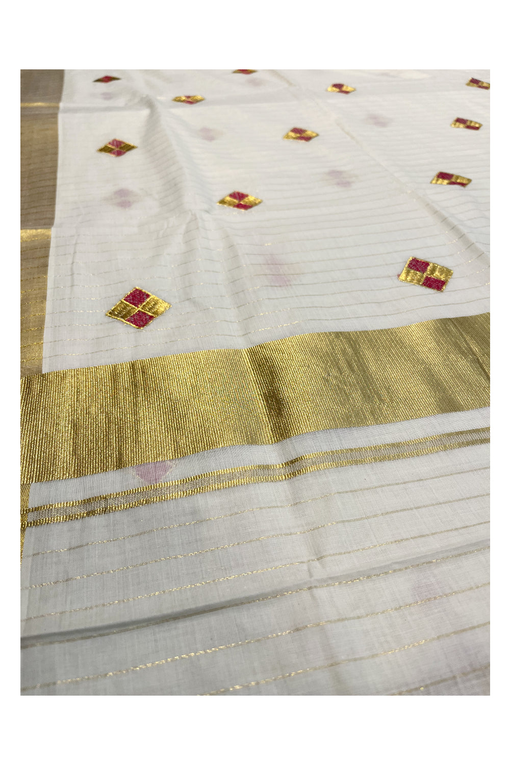 Kerala Cotton Kasavu Lines Saree with Pink and Golden Diagonal Embroidery Work