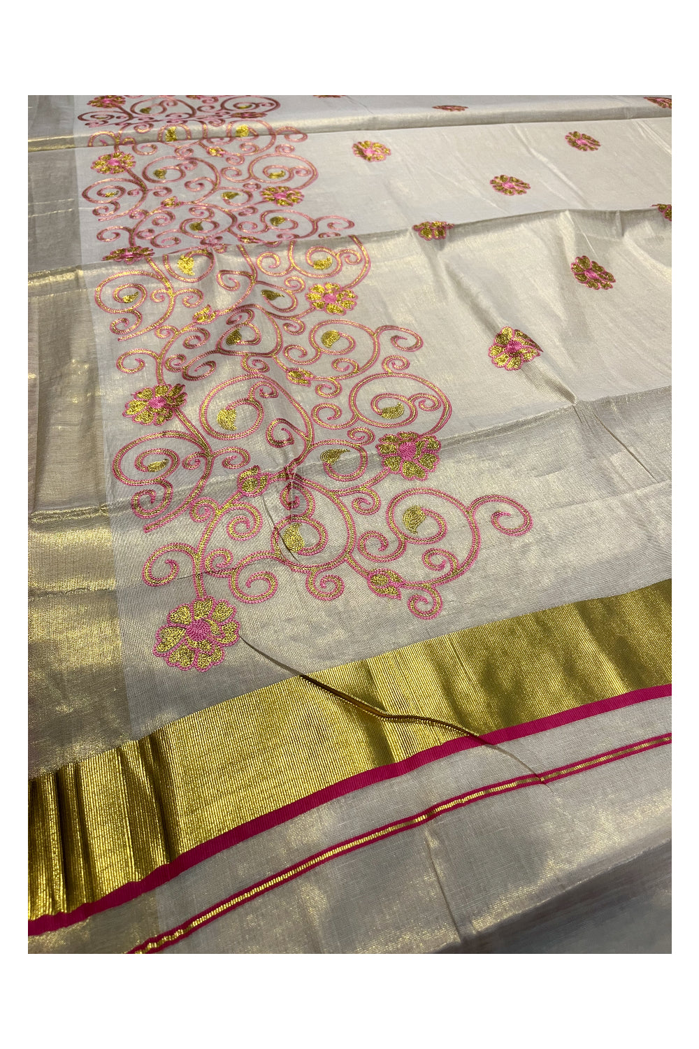 Kerala Tissue Kasavu Saree With Pink and Golden Floral Embroidery Works