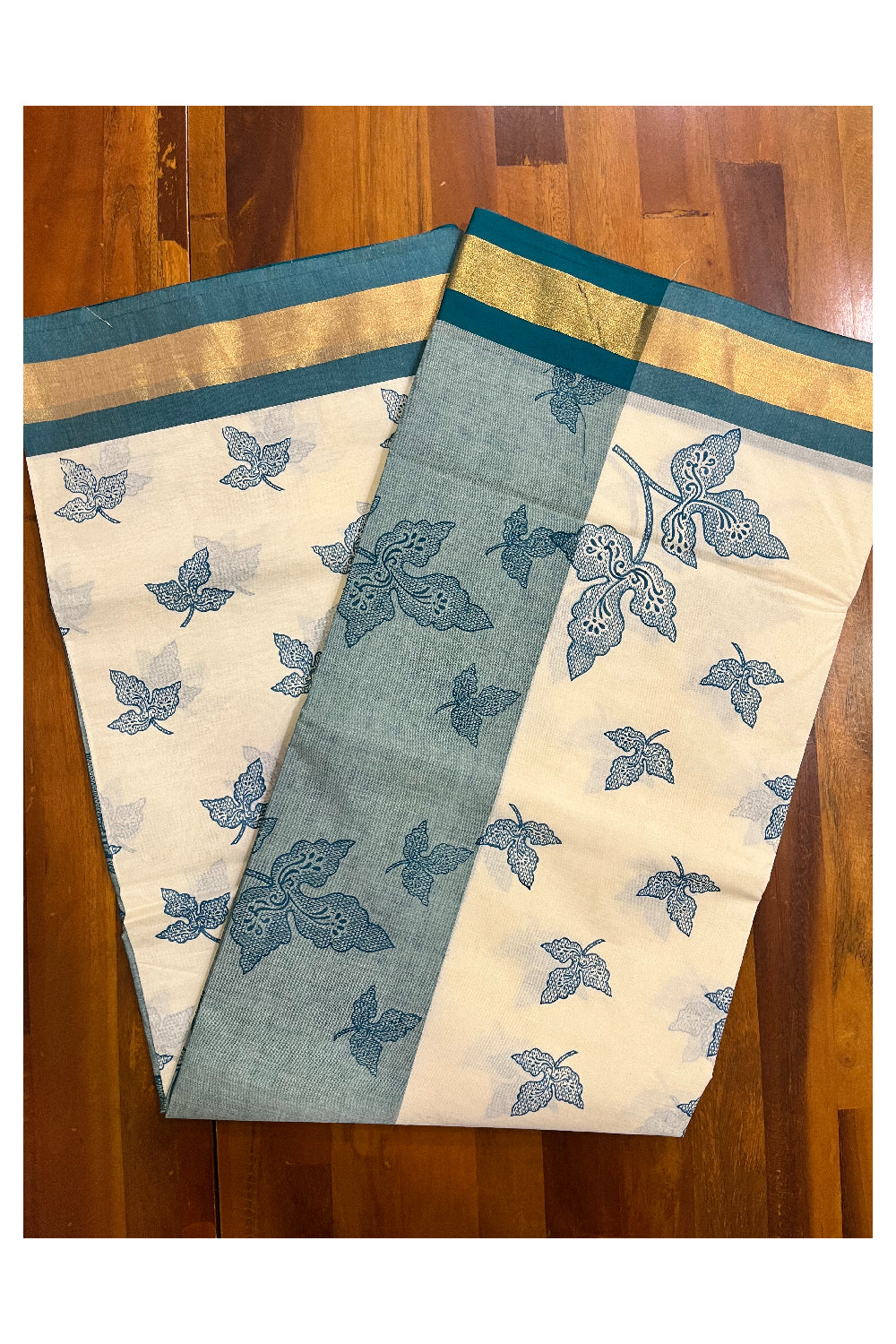 Pure Cotton Kerala Saree with Teal Block Print Leaf Designs and Kasavu Border (Vishu 2024 Collection)